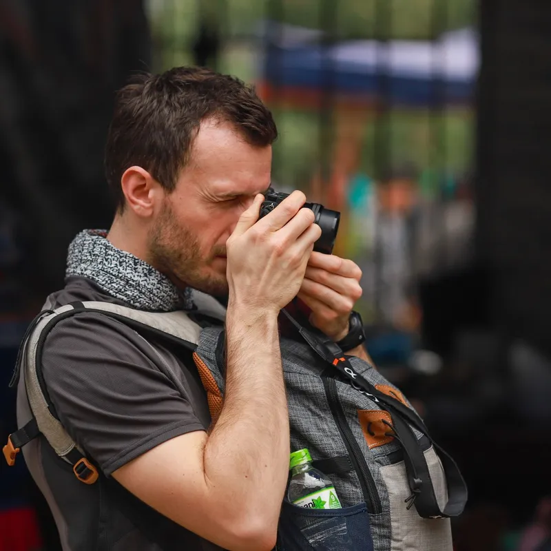 A photographer captures lively moments at an outdoor market in Lào Cai, Vietnam.